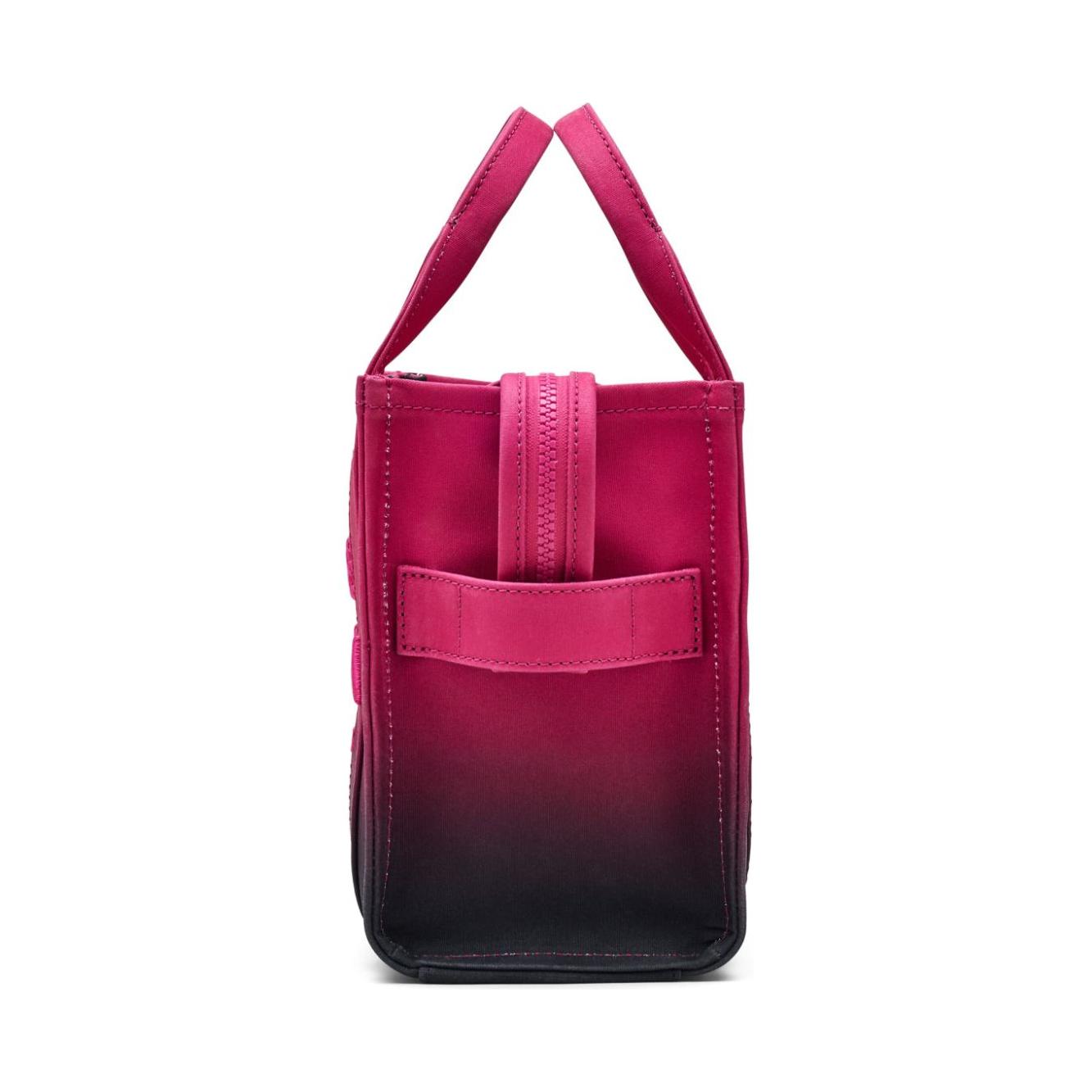 Front view with bag zipped and handles upright.