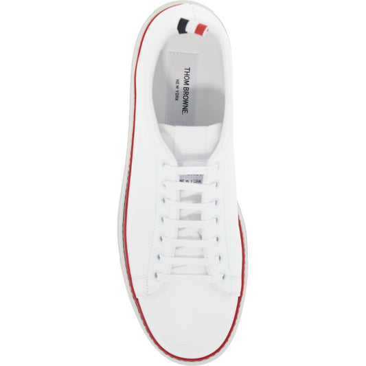 Thom Browne smooth leather sneakers with tricolor detail.